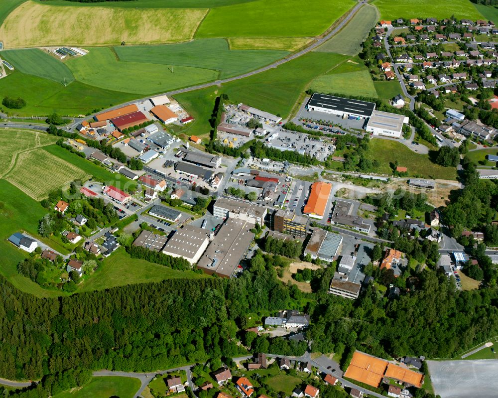 Kastenmühle from above - Industrial and commercial area on the edge of agricultural fields and fields in Kastenmühle in the state Bavaria, Germany