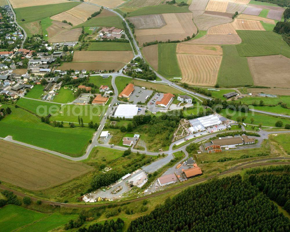 Aerial photograph Köditz - Industrial and commercial area on the edge of agricultural fields and fields in Köditz in the state Bavaria, Germany