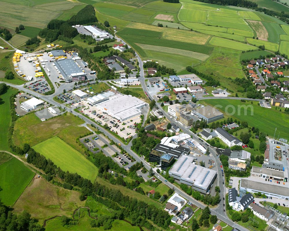 Aerial image Naila - Industrial and commercial area on the edge of agricultural fields and fields in Naila in the state Bavaria, Germany