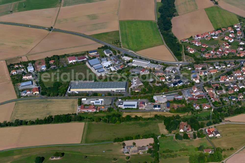 Aerial image Uettingen - Industrial and commercial area on the edge of agricultural fields and fields in Uettingen in the state Bavaria, Germany