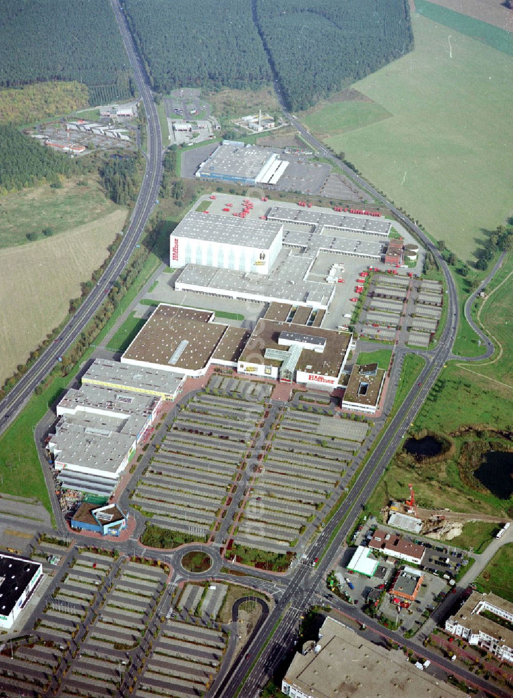 Waltersdorf from above - Industrial and commercial area on the edge of agricultural fields and fields on street Am Rondell in Waltersdorf in the state Brandenburg, Germany