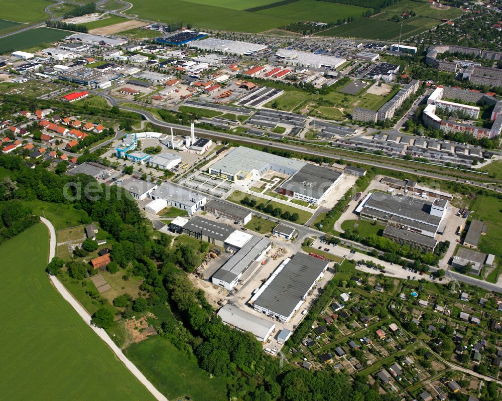 Wernigerode from the bird's eye view: Industrial and commercial area on the edge of agricultural fields and fields in Wernigerode in the Harz in the state Saxony-Anhalt, Germany