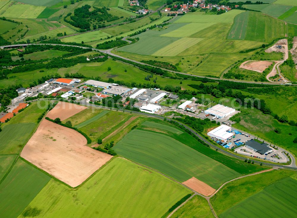 Winnweiler from above - Industrial and commercial area on the edge of agricultural fields and fields in Winnweiler in the state Rhineland-Palatinate, Germany