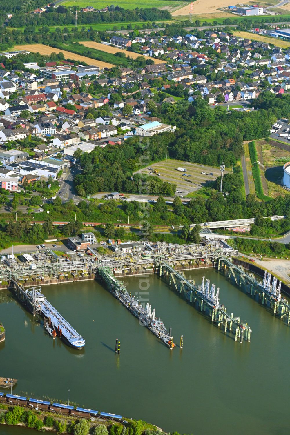 Köln from the bird's eye view: Water bridge with line systems of the LNG natural gas and liquid gas terminal and unloading quay on the banks of the Rhine on street Muehlenhof - Am Godorfer Hafen in the district Godorf in Cologne in the state North Rhine-Westphalia, Germany