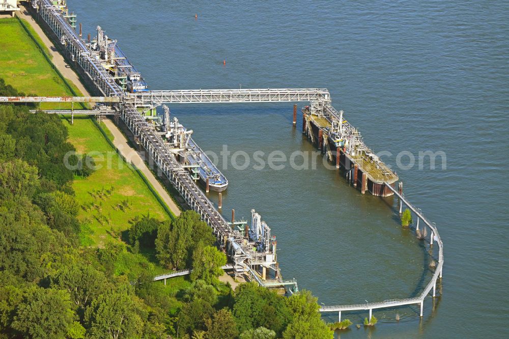 Niederkassel from the bird's eye view: Water bridge with pipeline systems of the LNG natural gas and liquefied petroleum gas terminal and unloading quay of Luelsdorf Functional Solutions GmbH on the banks of the Rhine in Niederkassel in the state of North Rhine-Westphalia, Germany