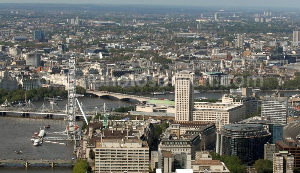 Aerial image London - View of the Ferris wheel London Eye on the banks of the River Thames in London. Opened in 2000, the wheel is also called the Millennium Wheel, and it is with 135 meters the tallest Ferris wheel in the world. The ride was designed by the architects David Mark and Julia Barfield