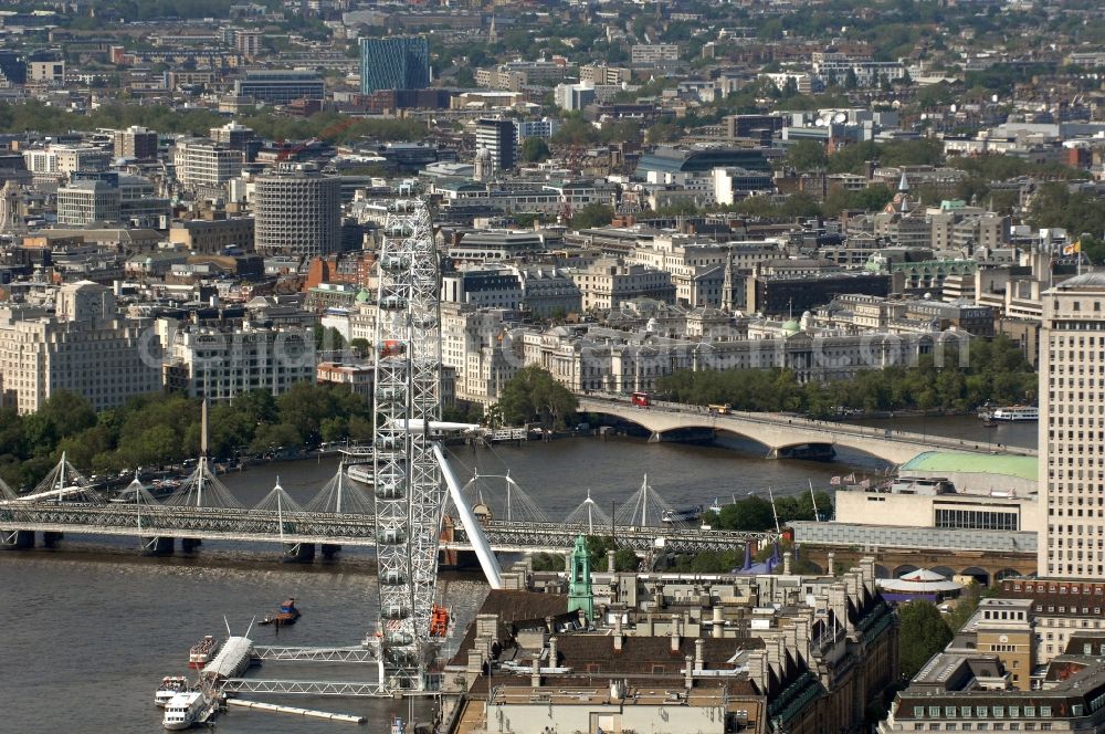 Aerial photograph London - View of the Ferris wheel London Eye on the banks of the River Thames in London. Opened in 2000, the wheel is also called the Millennium Wheel, and it is with 135 meters the tallest Ferris wheel in the world. The ride was designed by the architects David Mark and Julia Barfield