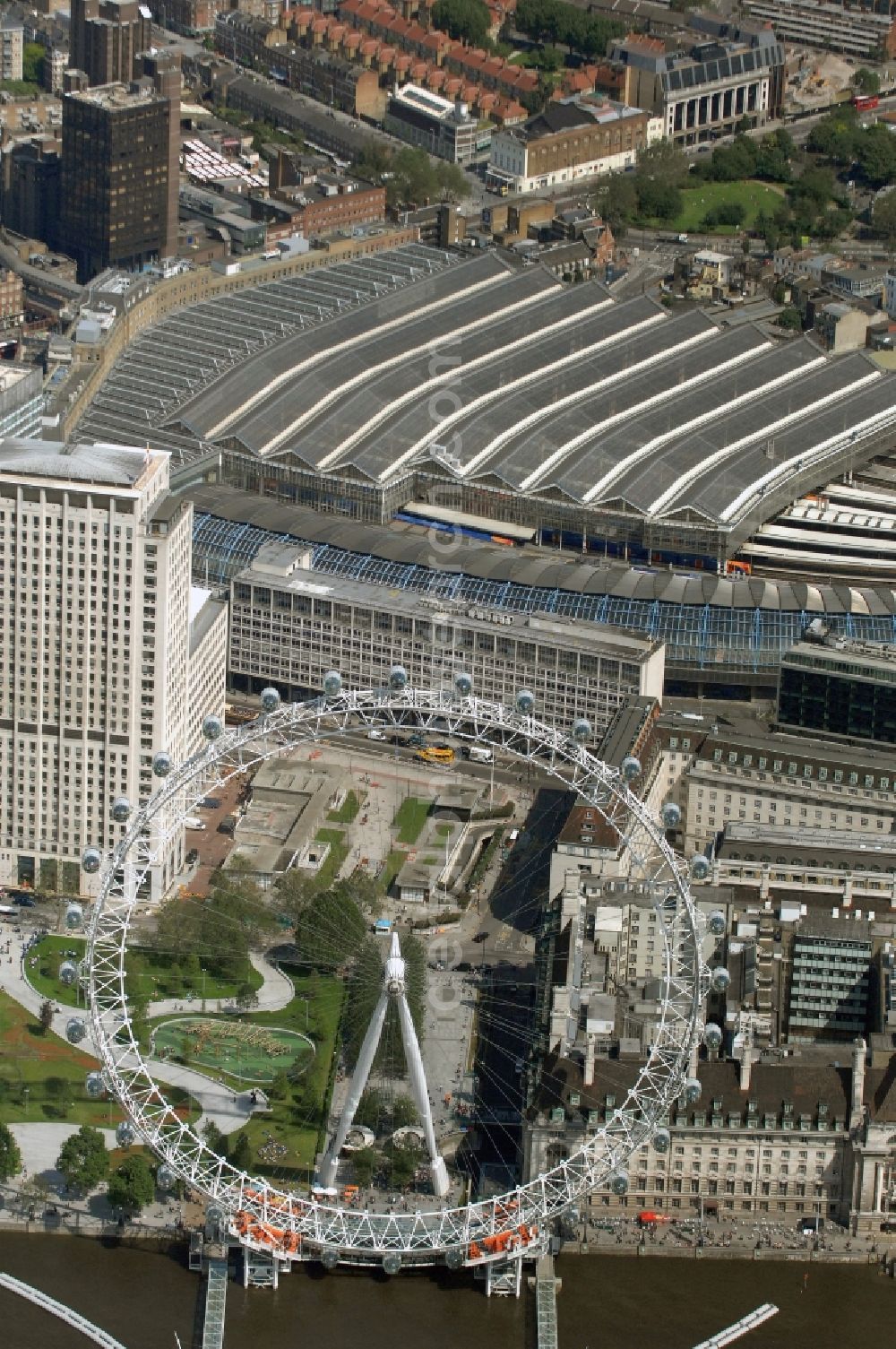 London from above - View the London Eye, also known as Millennium Wheel - a landmark of London. The current tallest Ferris wheel in Europe is the main attraction for tourists from around the world on the banks of the Thames Millennium Pier in front of the building of the London Sea Life Aquarium and Park Gardens Jubiles