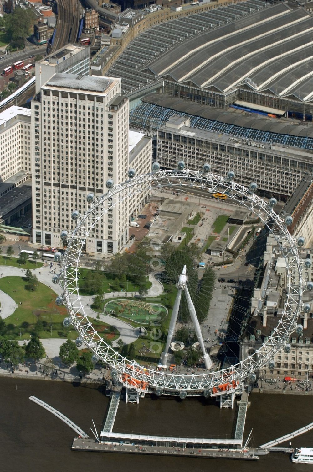 Aerial image London - View the London Eye, also known as Millennium Wheel - a landmark of London. The current tallest Ferris wheel in Europe is the main attraction for tourists from around the world on the banks of the Thames Millennium Pier in front of the building of the London Sea Life Aquarium and Park Gardens Jubiles