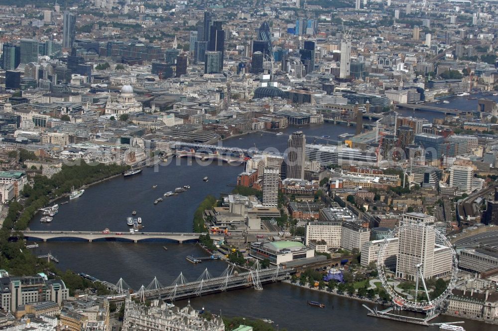 London from the bird's eye view: View the London Eye, also known as Millennium Wheel - a landmark of London. The current tallest Ferris wheel in Europe is the main attraction for tourists from around the world on the banks of the Thames Millennium Pier in front of the building of the London Sea Life Aquarium and Park Gardens Jubiles