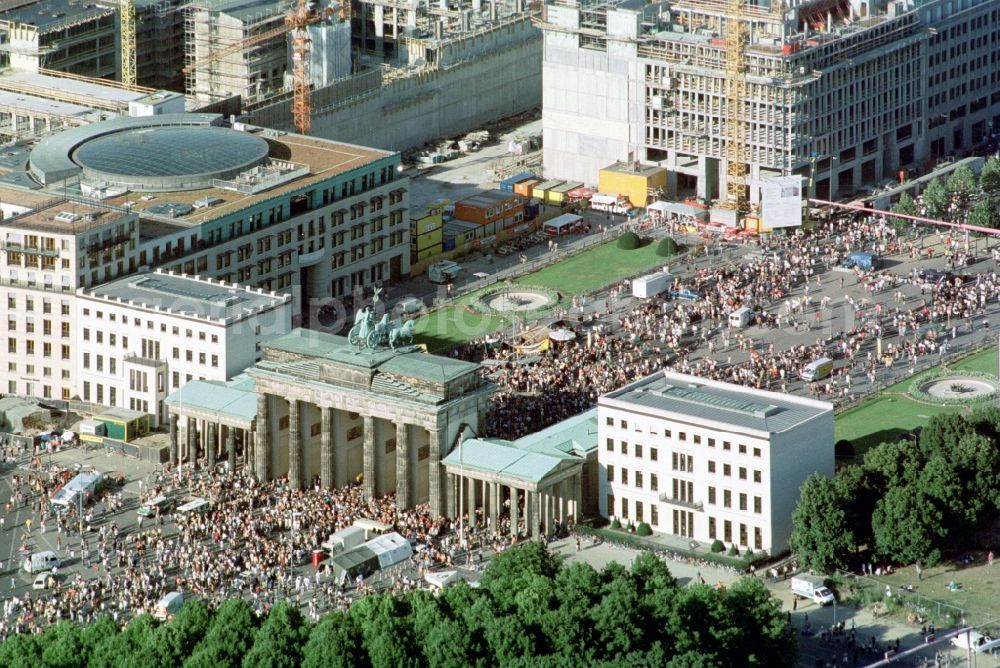 Aerial image Berlin - Participants in the Love Parade music festival on the event concert area on gate Brandenburger Tor in the district Mitte in Berlin, Germany