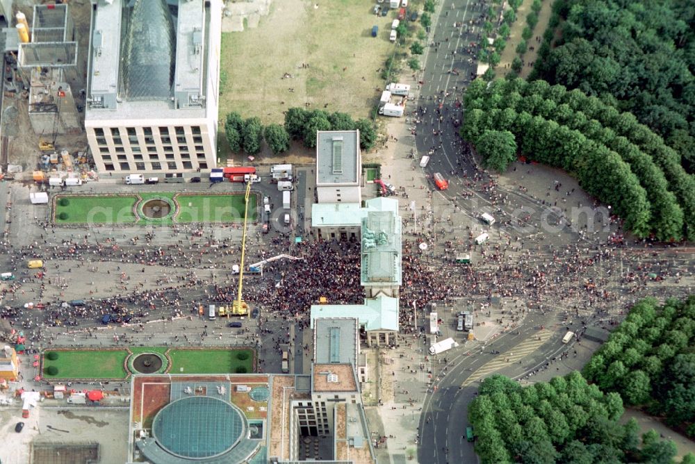 Berlin from above - Participants in the Love Parade music festival on the event concert area on gate Brandenburger Tor in the district Mitte in Berlin, Germany