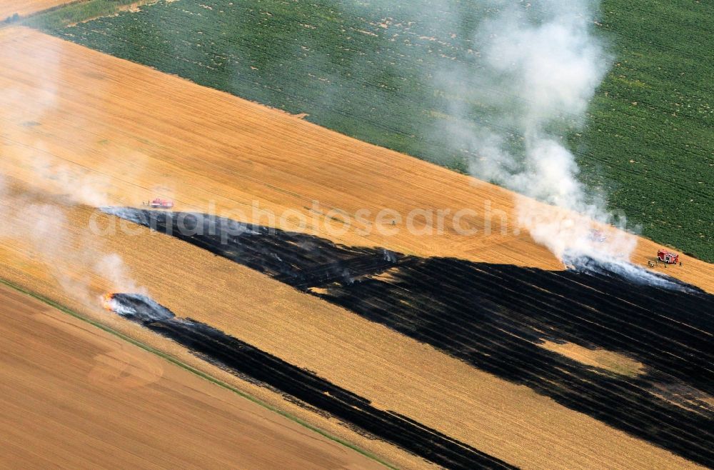 Aerial image Volkenroda - Unloading, the fire on a controlled field - fire on an agricultural property at Volkenroda in Thuringia. Foto: Karina Hessland