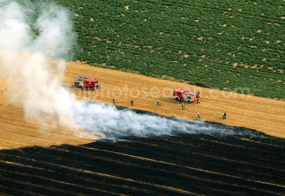 Aerial photograph Volkenroda - Unloading, the fire on a controlled field - fire on an agricultural property at Volkenroda in Thuringia. Foto: Karina Hessland