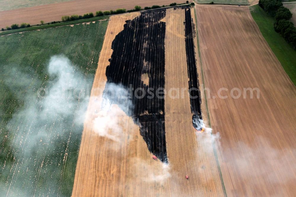 Aerial photograph Volkenroda - Unloading, the fire on a controlled field - fire on an agricultural property at Volkenroda in Thuringia. Foto: Karina Hessland