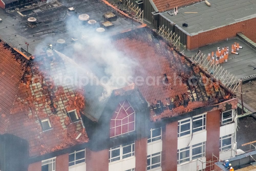 Bochum from the bird's eye view: Fire fighting at the fire brigade on fire the building Berufsgenossenschaftliches Universitaetsklinikum Bergmannsheil am Buerkle de la Camp-Platz in Bochum in the state North Rhine-Westphalia