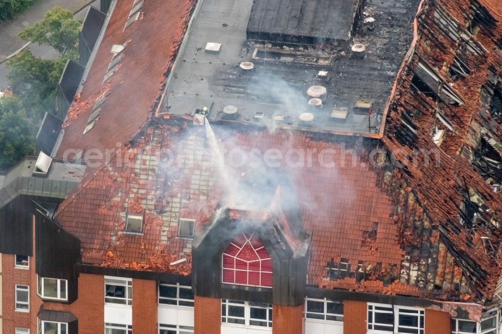 Bochum from the bird's eye view: Fire fighting at the fire brigade on fire the building Berufsgenossenschaftliches Universitaetsklinikum Bergmannsheil am Buerkle de la Camp-Platz in Bochum in the state North Rhine-Westphalia