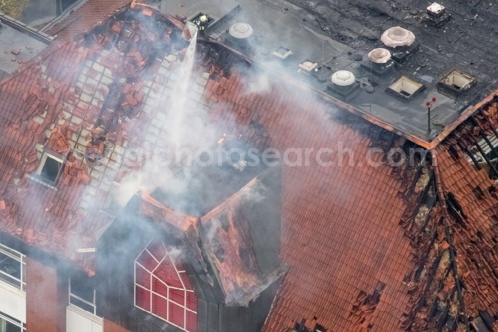 Bochum from the bird's eye view: Fire fighting at the fire brigade on fire the building Berufsgenossenschaftliches Universitaetsklinikum Bergmannsheil am Buerkle de la Camp-Platz in Bochum in the state North Rhine-Westphalia