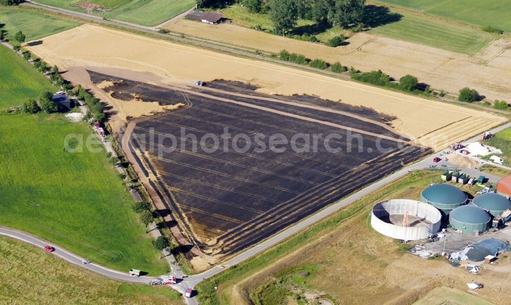 Aerial image Gieboldehausen - Fire fighting at the fire brigade on a field fire in Gieboldehausen in the state Lower Saxony, Germany