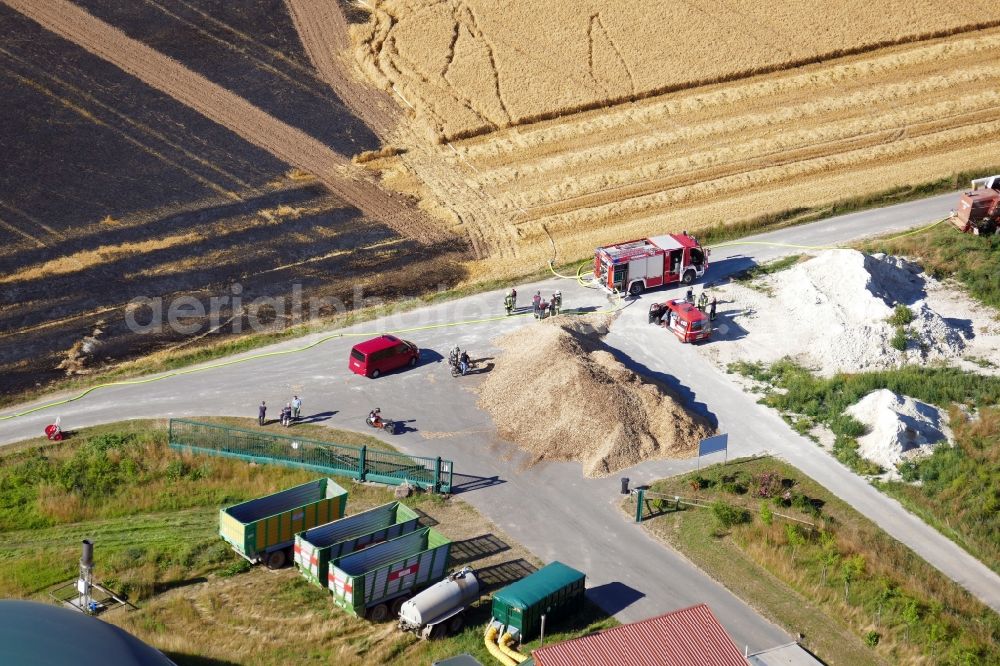 Aerial photograph Gieboldehausen - Fire fighting at the fire brigade on a field fire in Gieboldehausen in the state Lower Saxony, Germany