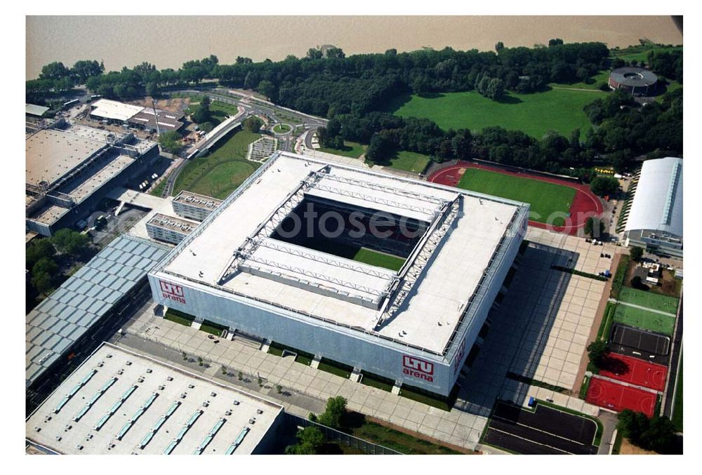 Düsseldorf from the bird's eye view: Blick auf die neu erbaubte LTU Arena heute Esprit Arena in Düsseldorf. Die Arena hat ein gigantisches verschließbares Dach, welches komplett 235 Meter lang und 201 Meter breit ist. Insgesamt verfügt die LTU Arena über 51.500 Sitzplätze und bietet bei Musikkonzerten inklusive Innenraum Platz für bis zu 65.000 Zuschauer. LTU arena, MULTIFUNKTIONSARENA DÜSSELDORF BETRIEBS-GMBH, Liesegangstr. 24, 40211 Düsseldorf, +49 (0) 2 11/20 95 47 -10, +49 (0) 2 11/20 95 47 -11, info@duesseldorf-multifunktionsarena.de