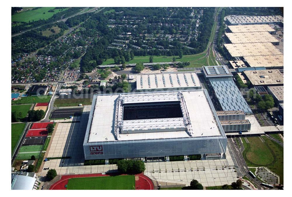 Aerial photograph Düsseldorf - Blick auf die neu erbaubte LTU Arena heute Esprit Arena in Düsseldorf. Die Arena hat ein gigantisches verschließbares Dach, welches komplett 235 Meter lang und 201 Meter breit ist. Insgesamt verfügt die LTU Arena über 51.500 Sitzplätze und bietet bei Musikkonzerten inklusive Innenraum Platz für bis zu 65.000 Zuschauer. LTU arena, MULTIFUNKTIONSARENA DÜSSELDORF BETRIEBS-GMBH, Liesegangstr. 24, 40211 Düsseldorf, +49 (0) 2 11/20 95 47 -10, +49 (0) 2 11/20 95 47 -11, info@duesseldorf-multifunktionsarena.de