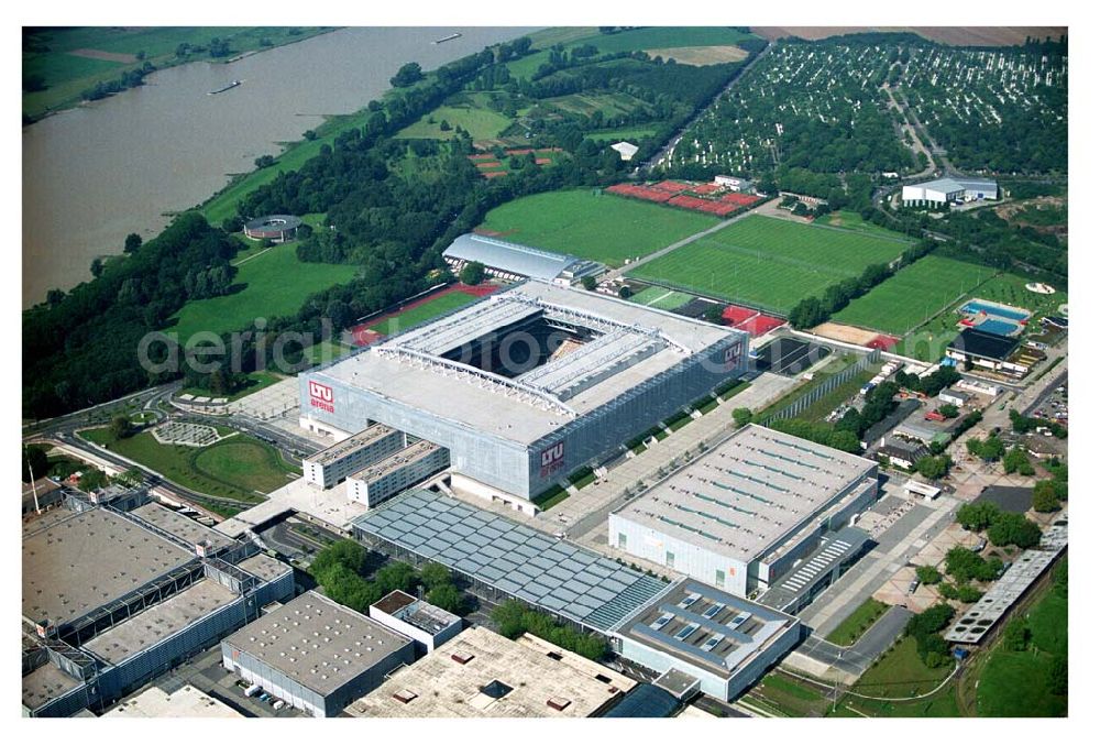 Düsseldorf from above - Blick auf die neu erbaubte LTU Arena heute Esprit Arena in Düsseldorf. Die Arena hat ein gigantisches verschließbares Dach, welches komplett 235 Meter lang und 201 Meter breit ist. Insgesamt verfügt die LTU Arena über 51.500 Sitzplätze und bietet bei Musikkonzerten inklusive Innenraum Platz für bis zu 65.000 Zuschauer. LTU arena, MULTIFUNKTIONSARENA DÜSSELDORF BETRIEBS-GMBH, Liesegangstr. 24, 40211 Düsseldorf, +49 (0) 2 11/20 95 47 -10, +49 (0) 2 11/20 95 47 -11, info@duesseldorf-multifunktionsarena.de