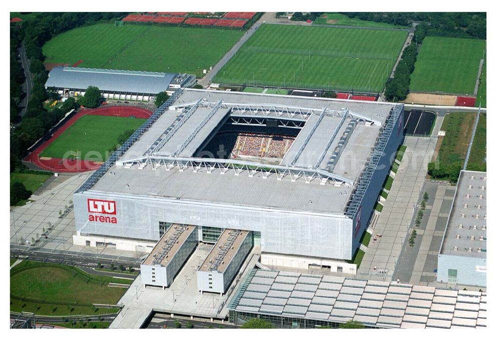 Aerial photograph Düsseldorf (NRW) - Blick auf die neu erbaubte LTU Arena heute Esprit Arena in Düsseldorf. Die Arena hat ein gigantisches verschließbares Dach, welches komplett 235 Meter lang und 201 Meter breit ist. Insgesamt verfügt die LTU Arena über 51.500 Sitzplätze und bietet bei Musikkonzerten inklusive Innenraum Platz für bis zu 65.000 Zuschauer. LTU arena, MULTIFUNKTIONSARENA DÜSSELDORF BETRIEBS-GMBH, Liesegangstr. 24, 40211 Düsseldorf, +49 (0) 2 11/20 95 47 -10, +49 (0) 2 11/20 95 47 -11, info@duesseldorf-multifunktionsarena.de