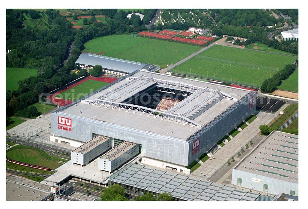 Düsseldorf (NRW) from the bird's eye view: Blick auf die neu erbaubte LTU Arena heute Esprit Arena in Düsseldorf. Die Arena hat ein gigantisches verschließbares Dach, welches komplett 235 Meter lang und 201 Meter breit ist. Insgesamt verfügt die LTU Arena über 51.500 Sitzplätze und bietet bei Musikkonzerten inklusive Innenraum Platz für bis zu 65.000 Zuschauer. LTU arena, MULTIFUNKTIONSARENA DÜSSELDORF BETRIEBS-GMBH, Liesegangstr. 24, 40211 Düsseldorf, +49 (0) 2 11/20 95 47 -10, +49 (0) 2 11/20 95 47 -11, info@duesseldorf-multifunktionsarena.de