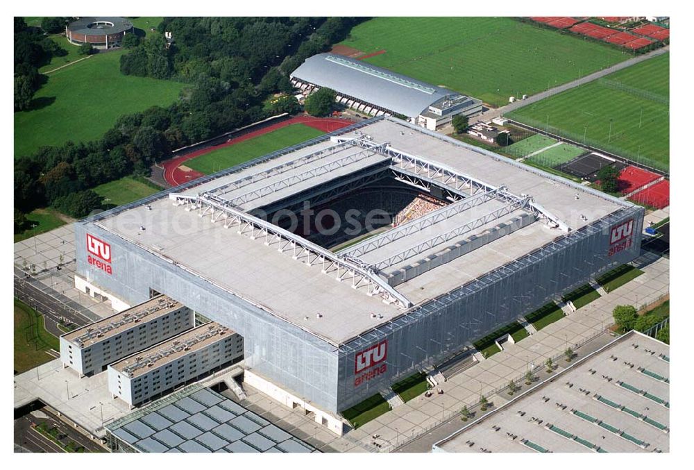 Aerial photograph Düsseldorf (NRW) - Blick auf die neu erbaubte LTU Arena heute Esprit Arena in Düsseldorf. Die Arena hat ein gigantisches verschließbares Dach, welches komplett 235 Meter lang und 201 Meter breit ist. Insgesamt verfügt die LTU Arena über 51.500 Sitzplätze und bietet bei Musikkonzerten inklusive Innenraum Platz für bis zu 65.000 Zuschauer. LTU arena, MULTIFUNKTIONSARENA DÜSSELDORF BETRIEBS-GMBH, Liesegangstr. 24, 40211 Düsseldorf, +49 (0) 2 11/20 95 47 -10, +49 (0) 2 11/20 95 47 -11, info@duesseldorf-multifunktionsarena.de