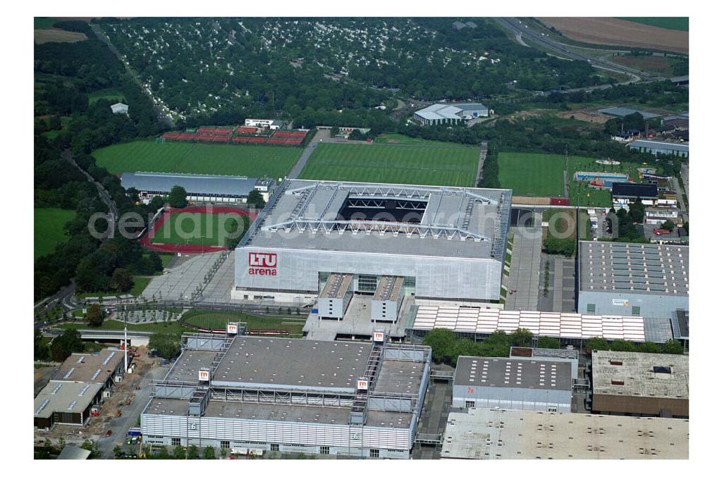 Düsseldorf (NRW) from above - Blick auf die neu erbaubte LTU Arena heute Esprit Arena in Düsseldorf. Die Arena hat ein gigantisches verschließbares Dach, welches komplett 235 Meter lang und 201 Meter breit ist. Insgesamt verfügt die LTU Arena über 51.500 Sitzplätze und bietet bei Musikkonzerten inklusive Innenraum Platz für bis zu 65.000 Zuschauer. LTU arena, MULTIFUNKTIONSARENA DÜSSELDORF BETRIEBS-GMBH, Liesegangstr. 24, 40211 Düsseldorf, +49 (0) 2 11/20 95 47 -10, +49 (0) 2 11/20 95 47 -11, info@duesseldorf-multifunktionsarena.de