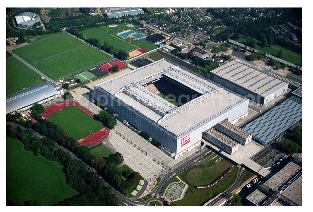 Düsseldorf (NRW) from the bird's eye view: Blick auf die neu erbaubte LTU Arena heute Esprit Arena in Düsseldorf. Die Arena hat ein gigantisches verschließbares Dach, welches komplett 235 Meter lang und 201 Meter breit ist. Insgesamt verfügt die LTU Arena über 51.500 Sitzplätze und bietet bei Musikkonzerten inklusive Innenraum Platz für bis zu 65.000 Zuschauer. LTU arena, MULTIFUNKTIONSARENA DÜSSELDORF BETRIEBS-GMBH, Liesegangstr. 24, 40211 Düsseldorf, +49 (0) 2 11/20 95 47 -10, +49 (0) 2 11/20 95 47 -11, info@duesseldorf-multifunktionsarena.de