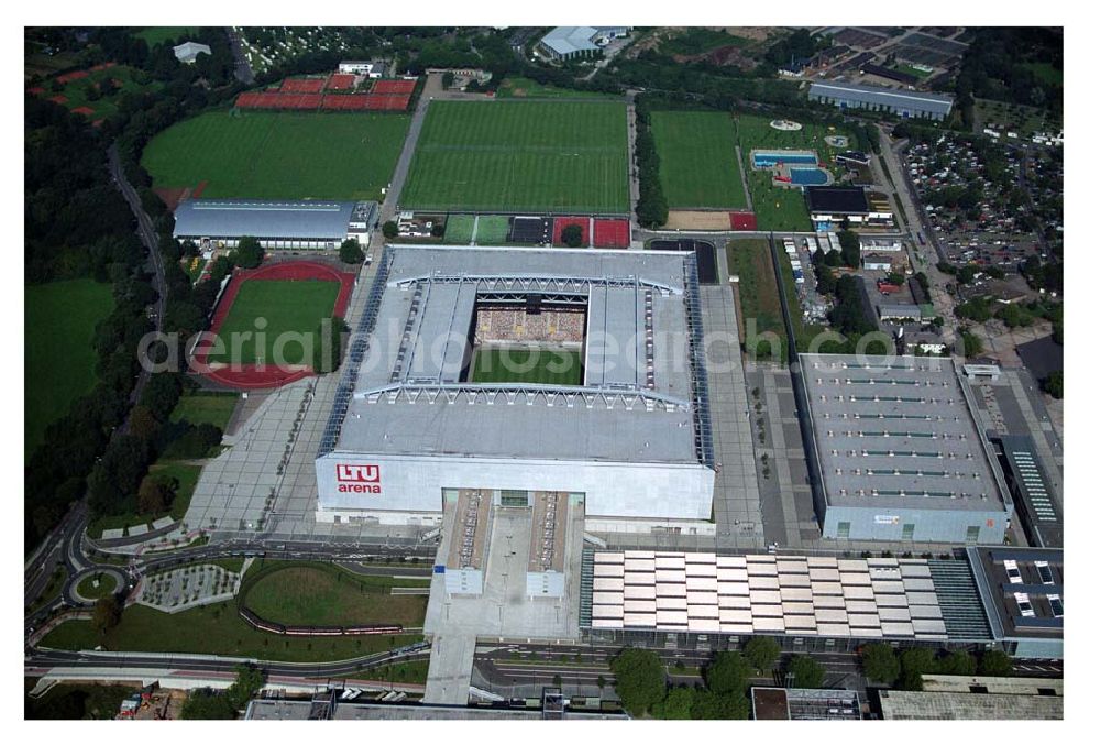 Aerial image Düsseldorf (NRW) - Blick auf die neu erbaubte LTU Arena heute Esprit Arena in Düsseldorf. Die Arena hat ein gigantisches verschließbares Dach, welches komplett 235 Meter lang und 201 Meter breit ist. Insgesamt verfügt die LTU Arena über 51.500 Sitzplätze und bietet bei Musikkonzerten inklusive Innenraum Platz für bis zu 65.000 Zuschauer. LTU arena, MULTIFUNKTIONSARENA DÜSSELDORF BETRIEBS-GMBH, Liesegangstr. 24, 40211 Düsseldorf, +49 (0) 2 11/20 95 47 -10, +49 (0) 2 11/20 95 47 -11, info@duesseldorf-multifunktionsarena.de