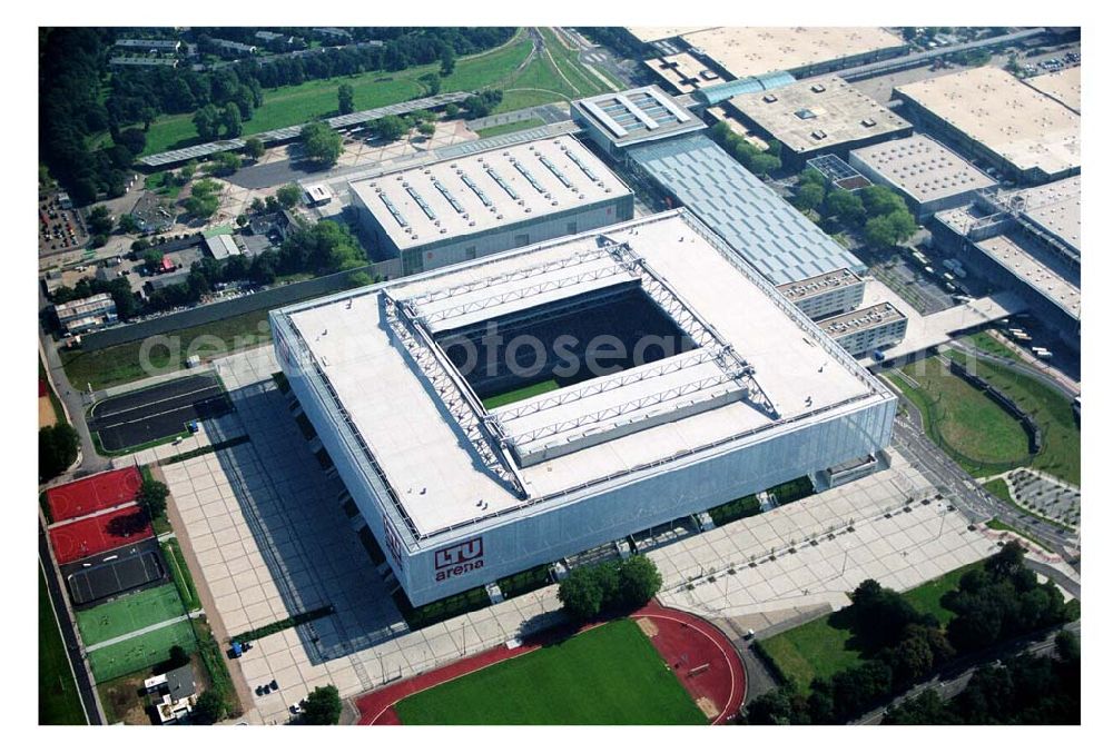 Düsseldorf (NRW) from above - Blick auf die neu erbaubte LTU Arena heute Esprit Arena in Düsseldorf. Die Arena hat ein gigantisches verschließbares Dach, welches komplett 235 Meter lang und 201 Meter breit ist. Insgesamt verfügt die LTU Arena über 51.500 Sitzplätze und bietet bei Musikkonzerten inklusive Innenraum Platz für bis zu 65.000 Zuschauer. LTU arena, MULTIFUNKTIONSARENA DÜSSELDORF BETRIEBS-GMBH, Liesegangstr. 24, 40211 Düsseldorf, +49 (0) 2 11/20 95 47 -10, +49 (0) 2 11/20 95 47 -11, info@duesseldorf-multifunktionsarena.de