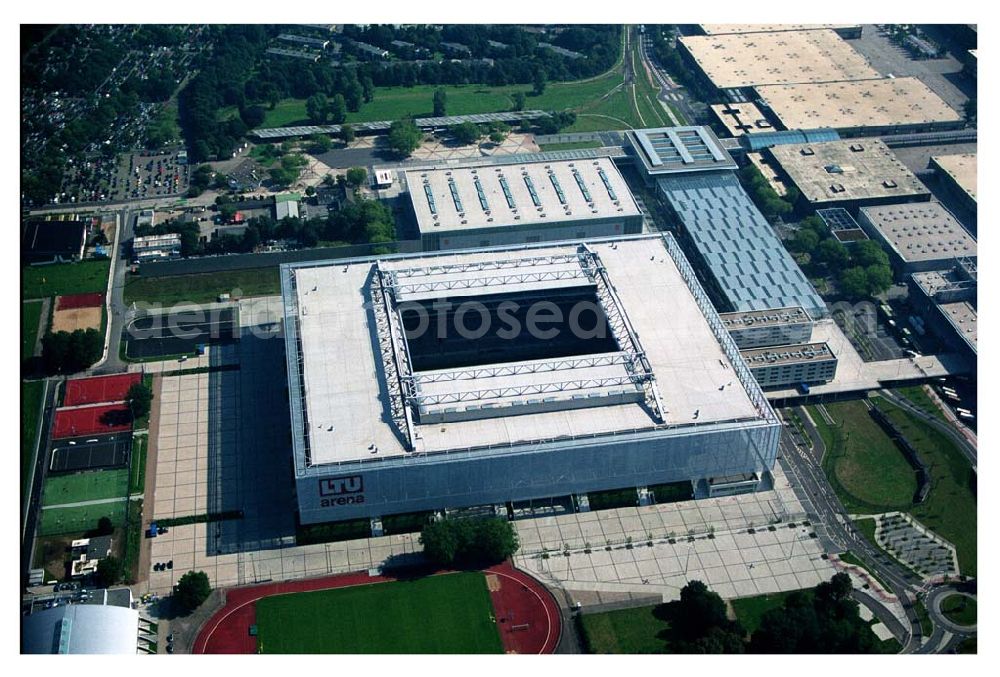 Düsseldorf (NRW) from the bird's eye view: Blick auf die neu erbaubte LTU Arena heute Esprit Arena in Düsseldorf. Die Arena hat ein gigantisches verschließbares Dach, welches komplett 235 Meter lang und 201 Meter breit ist. Insgesamt verfügt die LTU Arena über 51.500 Sitzplätze und bietet bei Musikkonzerten inklusive Innenraum Platz für bis zu 65.000 Zuschauer. LTU arena, MULTIFUNKTIONSARENA DÜSSELDORF BETRIEBS-GMBH, Liesegangstr. 24, 40211 Düsseldorf, +49 (0) 2 11/20 95 47 -10, +49 (0) 2 11/20 95 47 -11, info@duesseldorf-multifunktionsarena.de