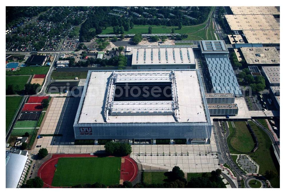 Aerial image Düsseldorf (NRW) - Blick auf die neu erbaubte LTU Arena heute Esprit Arena in Düsseldorf. Die Arena hat ein gigantisches verschließbares Dach, welches komplett 235 Meter lang und 201 Meter breit ist. Insgesamt verfügt die LTU Arena über 51.500 Sitzplätze und bietet bei Musikkonzerten inklusive Innenraum Platz für bis zu 65.000 Zuschauer. LTU arena, MULTIFUNKTIONSARENA DÜSSELDORF BETRIEBS-GMBH, Liesegangstr. 24, 40211 Düsseldorf, +49 (0) 2 11/20 95 47 -10, +49 (0) 2 11/20 95 47 -11, info@duesseldorf-multifunktionsarena.de