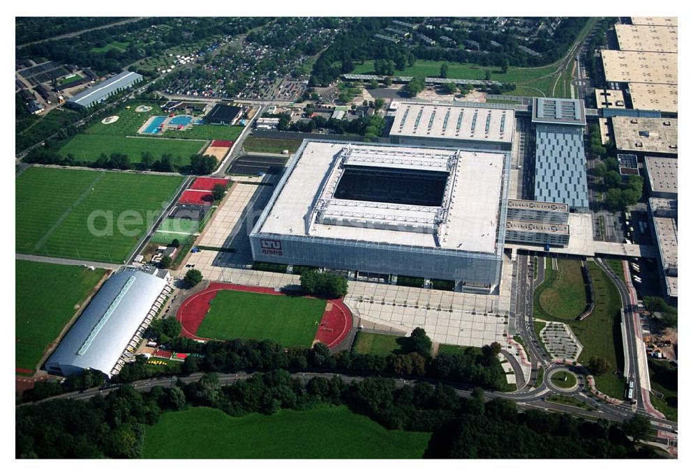 Aerial photograph Düsseldorf (NRW) - Blick auf die neu erbaubte LTU Arena heute Esprit Arena in Düsseldorf. Die Arena hat ein gigantisches verschließbares Dach, welches komplett 235 Meter lang und 201 Meter breit ist. Insgesamt verfügt die LTU Arena über 51.500 Sitzplätze und bietet bei Musikkonzerten inklusive Innenraum Platz für bis zu 65.000 Zuschauer. LTU arena, MULTIFUNKTIONSARENA DÜSSELDORF BETRIEBS-GMBH, Liesegangstr. 24, 40211 Düsseldorf, +49 (0) 2 11/20 95 47 -10, +49 (0) 2 11/20 95 47 -11, info@duesseldorf-multifunktionsarena.de