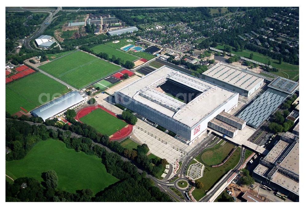 Düsseldorf (NRW) from above - Blick auf die neu erbaubte LTU Arena heute Esprit Arena in Düsseldorf. Die Arena hat ein gigantisches verschließbares Dach, welches komplett 235 Meter lang und 201 Meter breit ist. Insgesamt verfügt die LTU Arena über 51.500 Sitzplätze und bietet bei Musikkonzerten inklusive Innenraum Platz für bis zu 65.000 Zuschauer. LTU arena, MULTIFUNKTIONSARENA DÜSSELDORF BETRIEBS-GMBH, Liesegangstr. 24, 40211 Düsseldorf, +49 (0) 2 11/20 95 47 -10, +49 (0) 2 11/20 95 47 -11, info@duesseldorf-multifunktionsarena.de