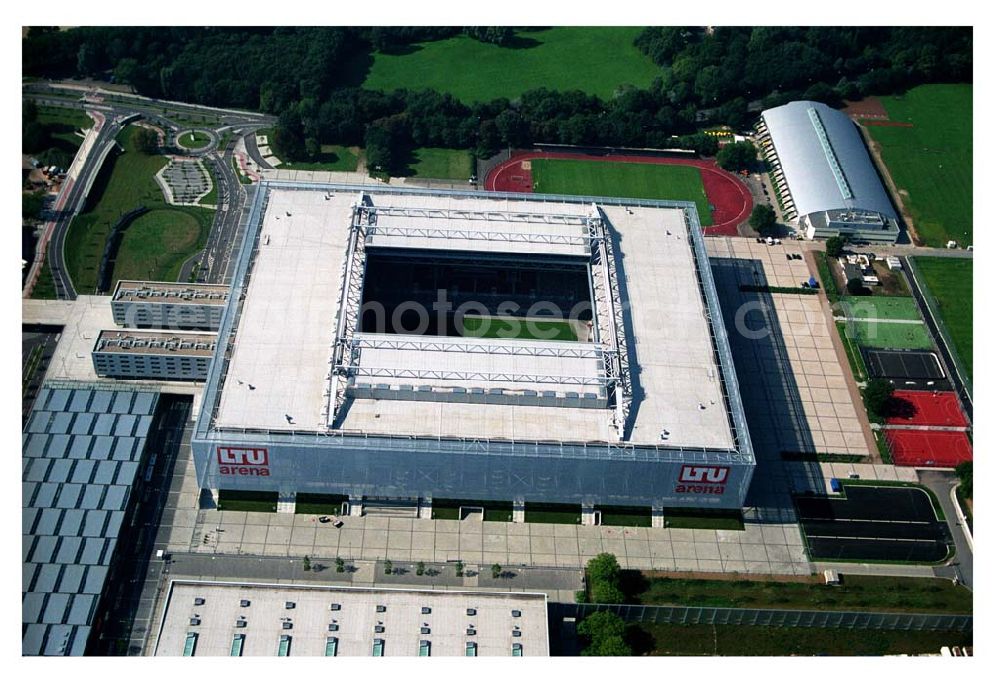 Düsseldorf (NRW) from the bird's eye view: Blick auf die neu erbaubte LTU Arena heute Esprit Arena in Düsseldorf. Die Arena hat ein gigantisches verschließbares Dach, welches komplett 235 Meter lang und 201 Meter breit ist. Insgesamt verfügt die LTU Arena über 51.500 Sitzplätze und bietet bei Musikkonzerten inklusive Innenraum Platz für bis zu 65.000 Zuschauer. LTU arena, MULTIFUNKTIONSARENA DÜSSELDORF BETRIEBS-GMBH, Liesegangstr. 24, 40211 Düsseldorf, +49 (0) 2 11/20 95 47 -10, +49 (0) 2 11/20 95 47 -11, info@duesseldorf-multifunktionsarena.de