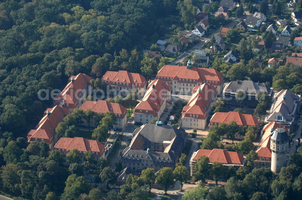 Aerial photograph Berlin - Blick auf den Ludwig Park Wohnen für Generationen mit dem Wasserturm in Buch. Das ehemalige Alte Leute Heim Ludwig Hoffmanns wird durch die LudwigPark Berlin GmbH stufenweise denkmalgerecht saniert. Geplant sind auf dem 100.000 qm großem Grundstück u.a. Wohnungen, betreutes Wohnen, Pflegestationen und ein Hotel.