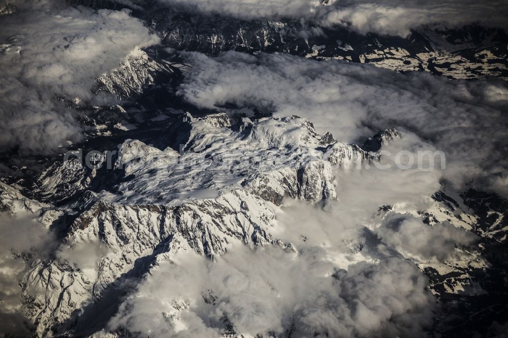 Aerial photograph Locarno - Luftaufnahme aus 10.000 Meter Höhe vom schneebedeckten Gebirge der Alpen in Locarno in der Schweiz. / Aerial view from 10,000 meters from snow-capped mountains of the Alps in Locarno, Switzerland.