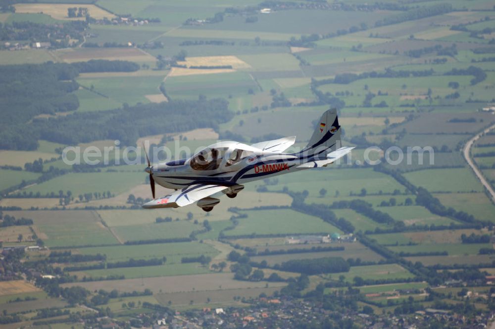 Neumünster from above - Blick auf ein Ultraleichtflugzeug des Typs Eurostar 300 bei einem Luftbildflug in der Nähe von Neumünster in Schleswig-Holstein / SH. View to a microlight of the type Eurostar 300 during a flight for aerial photographies near Neumünster in Schleswig-Holstein / SH.