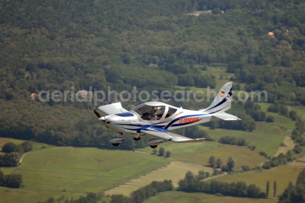 Wedel from above - Blick auf ein Ultraleichtflugzeug des Typs Eurostar 300 bei einem Luftbildflug in der Nähe von Neumünster in Schleswig-Holstein / SH. View to a microlight of the type Eurostar 300 during a flight for aerial photographies near Wedel in Schleswig-Holstein / SH.