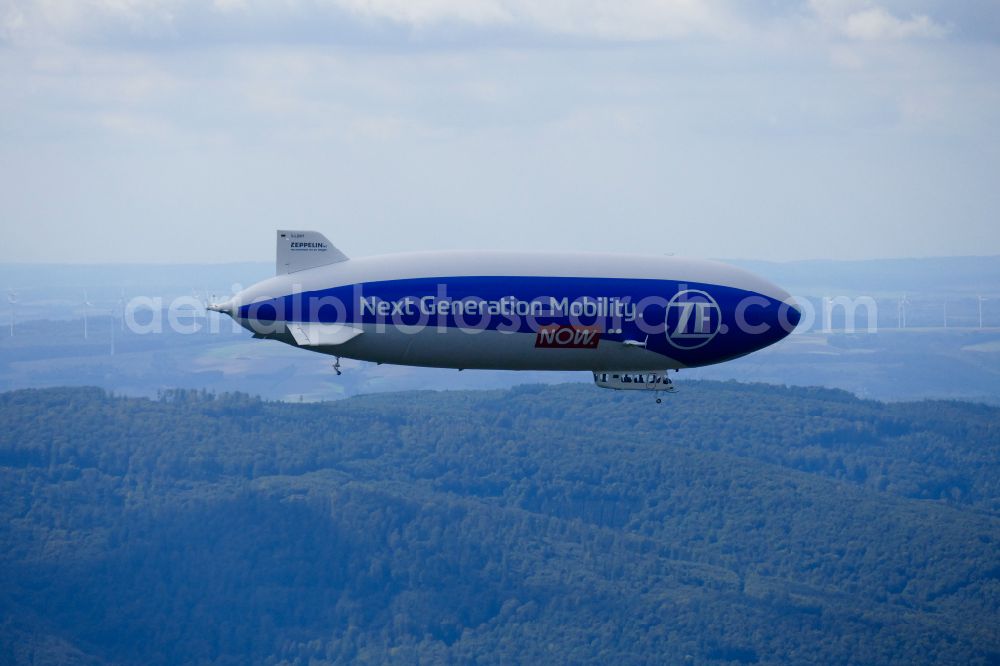 Wesertal from the bird's eye view: Airship D-LZNT in flight over the airspace on street L763 in Wesertal in the state Hesse, Germany