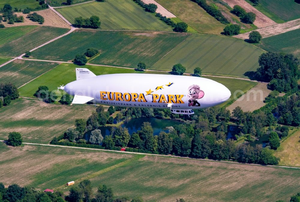 Rheinau from the bird's eye view: Airship Zeppelin NT beim Europa-Park in flight over the airspace in Rheinau in the state Baden-Wuerttemberg, Germany