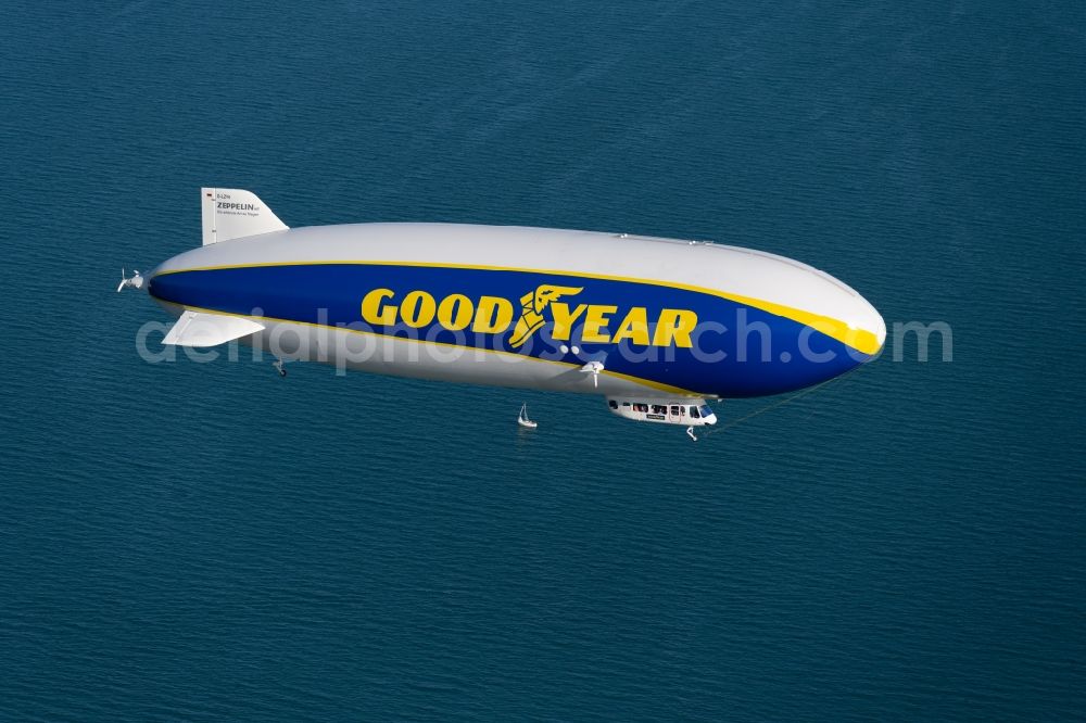 Aerial image Friedrichshafen - Airship Zeppelin NT N07 with the identification D-LZFN of the Deutsche Zeppelin Reederei in flight over the airspace in Friedrichshafen in the state Baden-Wuerttemberg, Germany