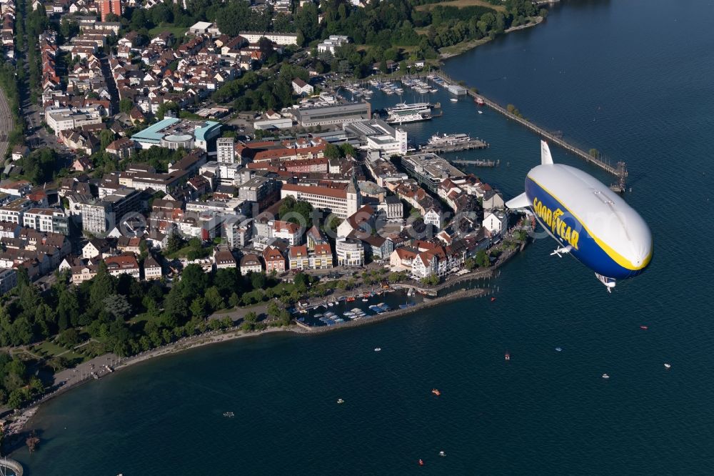 Aerial photograph Friedrichshafen - Airship Zeppelin NT N07 with the identification D-LZFN of the Deutsche Zeppelin Reederei in flight over the airspace in Friedrichshafen in the state Baden-Wuerttemberg, Germany