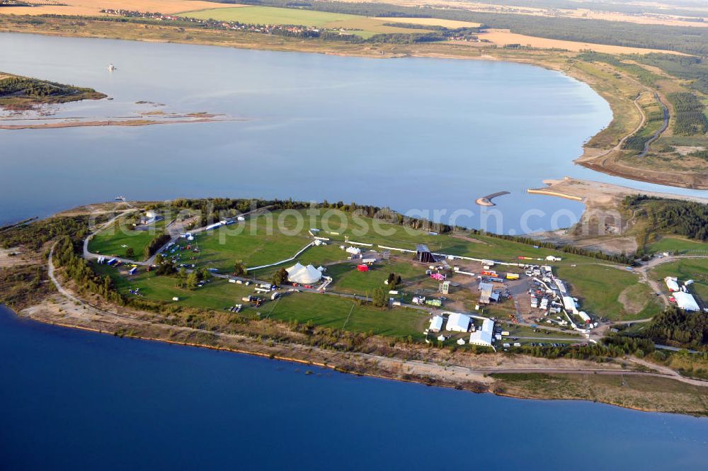 Aerial image Großpösna - Auf dem Gelände des ehemaligen Braunkohle Tagebaus Espenhain in Sachsen enstanden der Störmthaler See und die Magdeborner Halbinsel, auf der unter an derem das Highfield-Festival stattfindet. Der ehemalige Tagebau wurde am 13. September 2003 geflutet. The former opencast mining Espenhain in Saxony turned into a lake and a peninsula called Magdeborner Halbinsel on which fastivals take place. It is situated near Großpoesna.