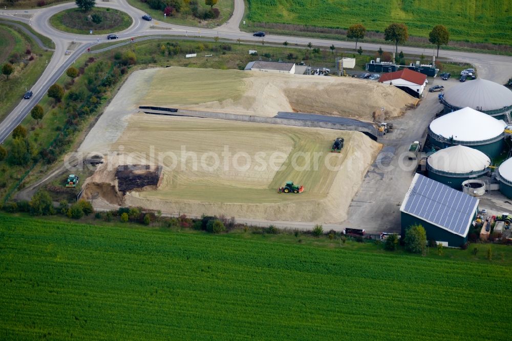 Aerial photograph Rosdorf - Maize crop on a grain storage and storage area of an agricultural in Rosdorf in the state Lower Saxony, Germany