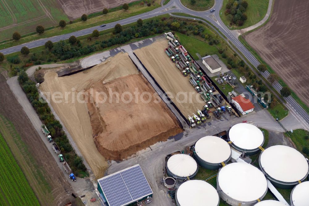 Aerial photograph Rosdorf - Maize crop on a grain storage and storage area of an agricultural in Rosdorf in the state Lower Saxony, Germany